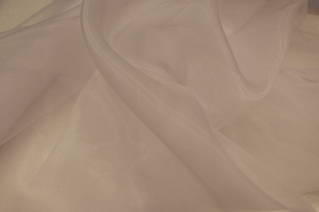 Luxurious silk fabric with smooth texture and elegant drape, ideal for high-end textiles and fashion.