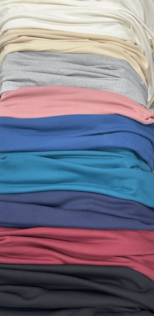 Soft fleece fabrics in various colors for cozy textiles and apparel.
