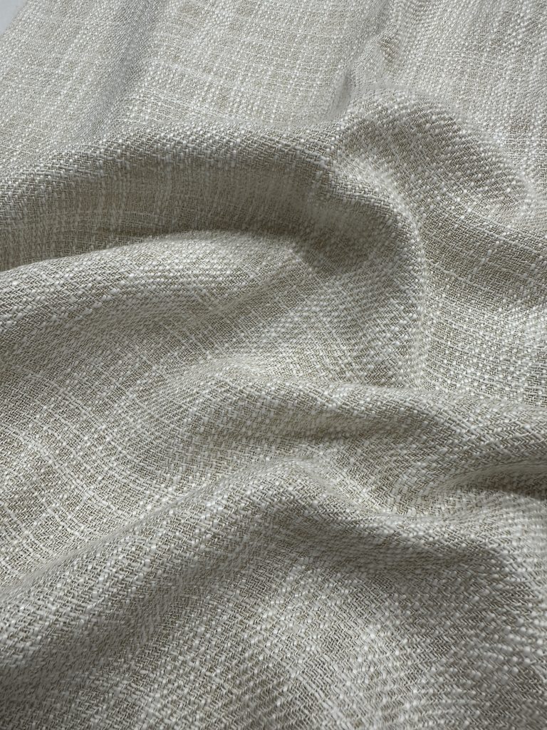 Light beige linen fabric with a subtle textured weave, ideal for upholstery and home decor projects.