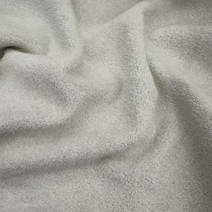 Soft beige fabric with a smooth, plush texture ideal for upholstery, curtains, and textile projects.