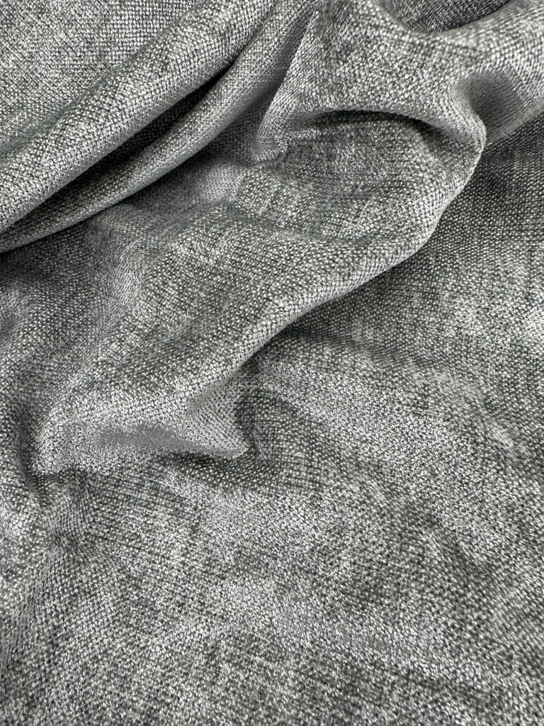 Gray linen fabric with a textured, natural appearance suitable for upholstery and clothing projects.
