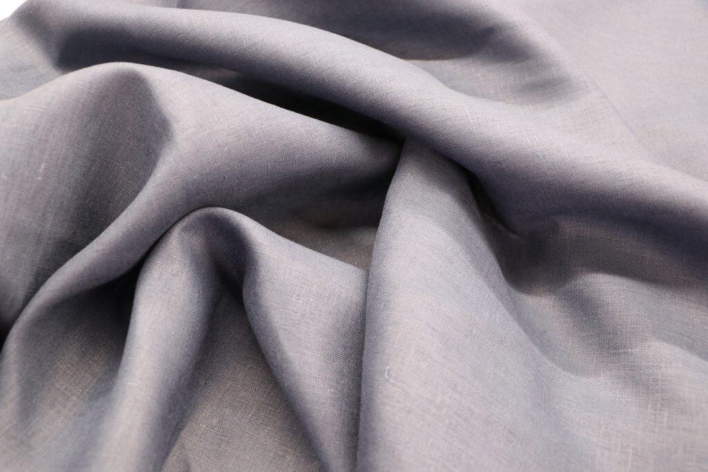 Pure linen fabric in light gray, 195 GSM, ideal for high-quality textiles and upholstery.