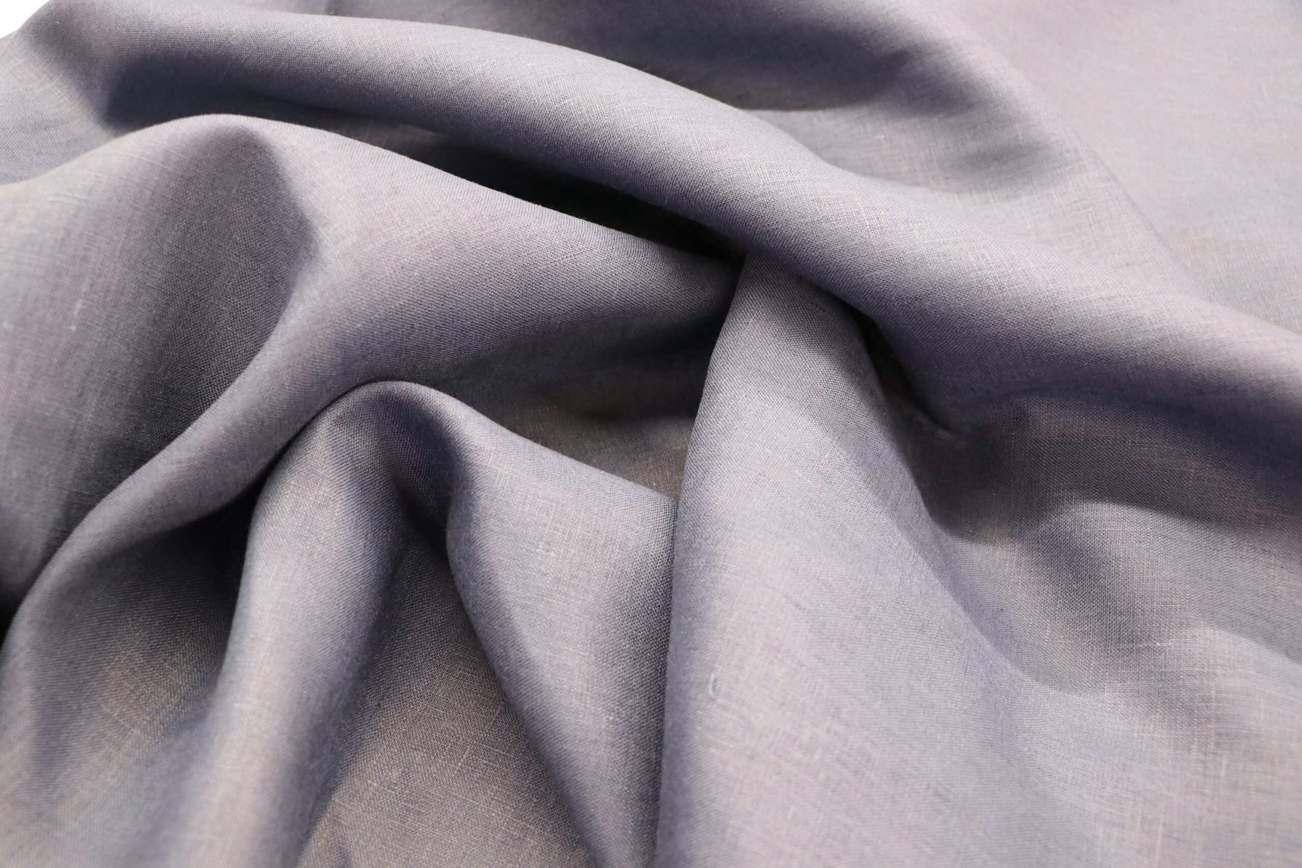 Pure linen fabric in light gray, 195 GSM, ideal for high-quality textiles and upholstery.