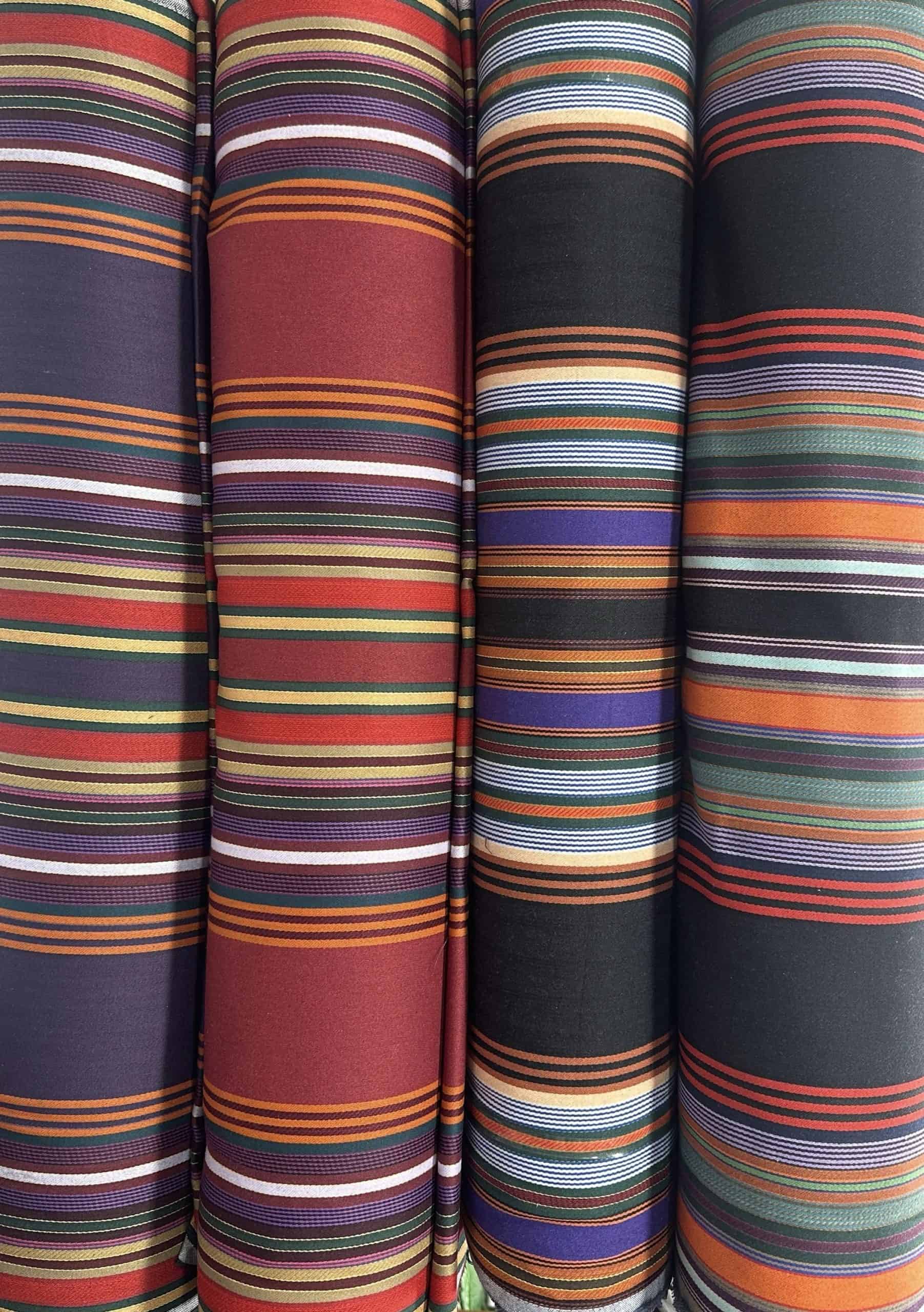 Vibrant striped textiles showcasing diverse color patterns and textures.