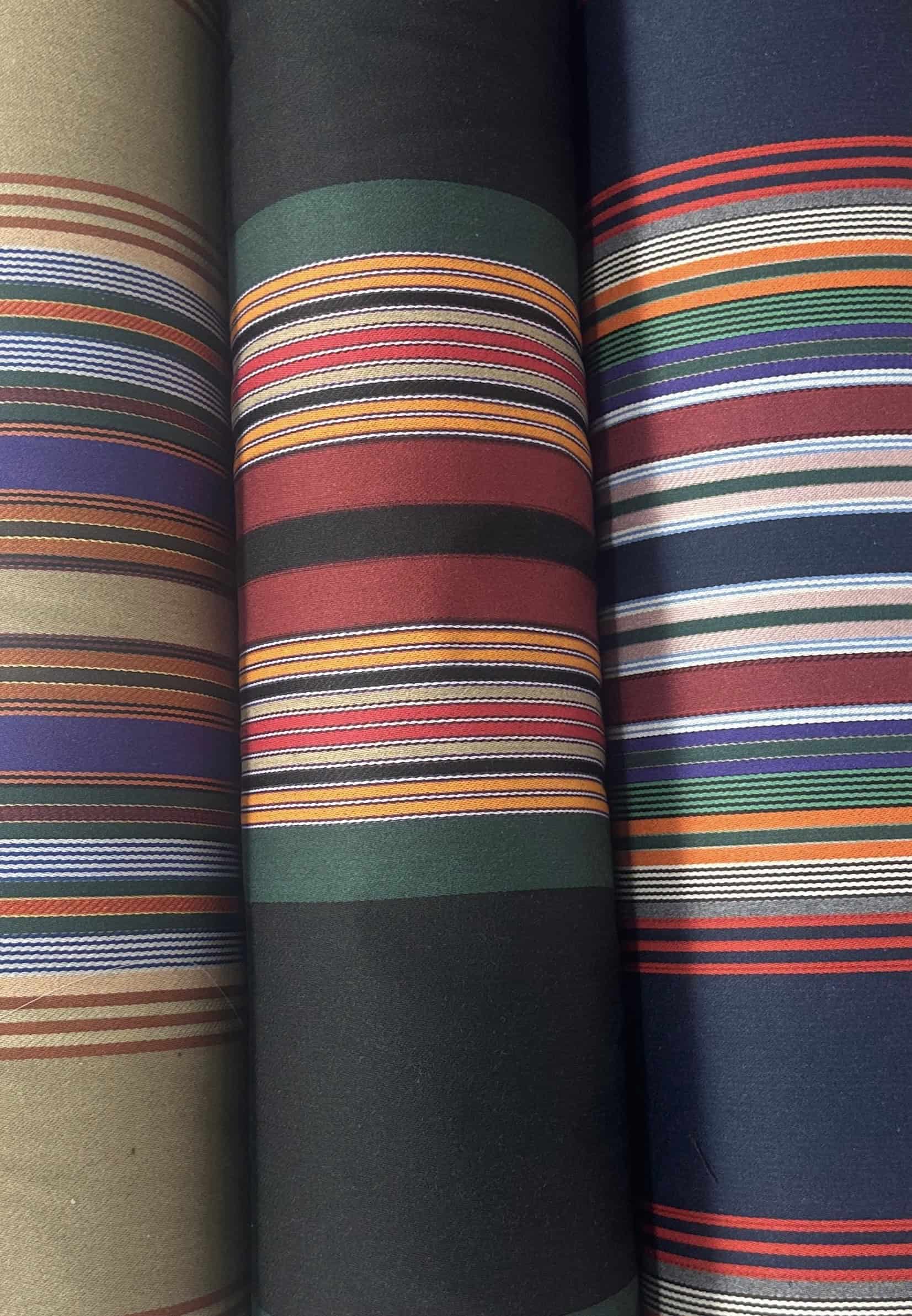 Vibrant striped textiles showcasing diverse colors and patterns at ZIAD Fabrics.