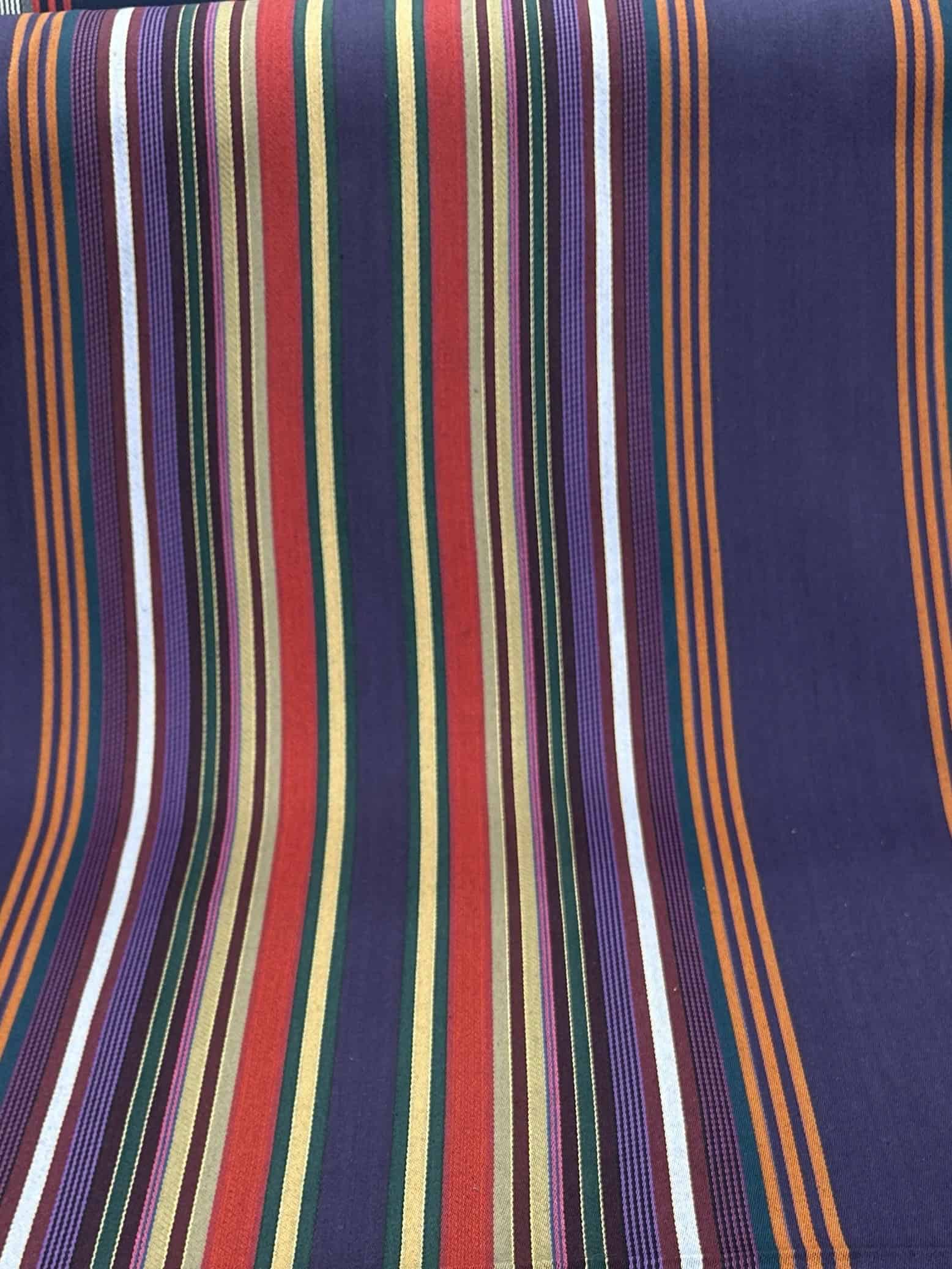 Vibrant striped textile fabric showcasing multiple colors and patterns.