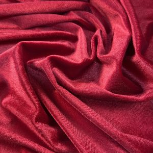 Red velvet spandex fabric with smooth, luxurious texture and vibrant color.
