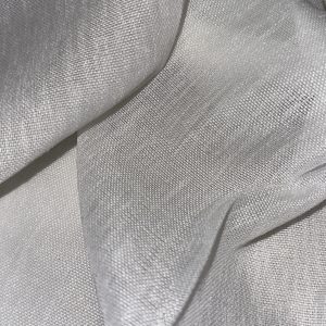 Close-up of silver woven fabric showcasing fine texture and sheen.